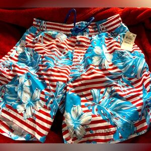 striped red and white club room swimming trunks with light blue palm leaves